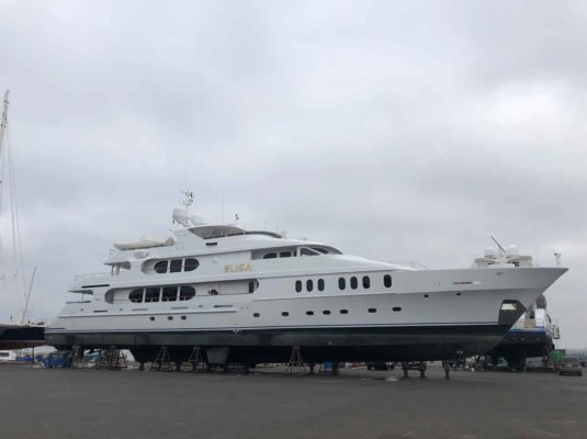 Large white superyacht out of water