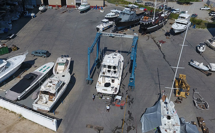 boat yard with yacht being worked on