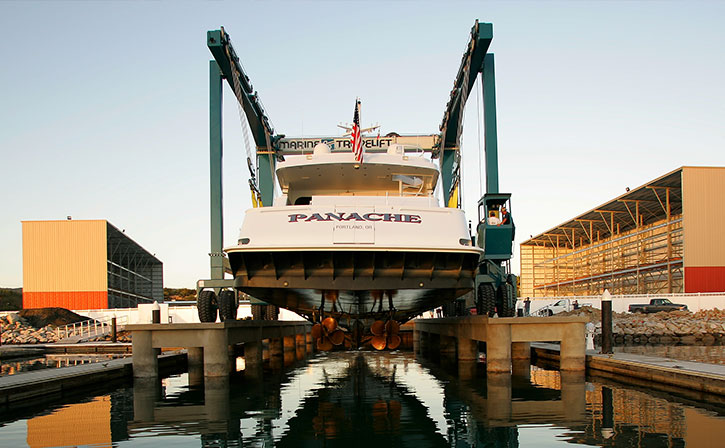 yacht being lifted over water